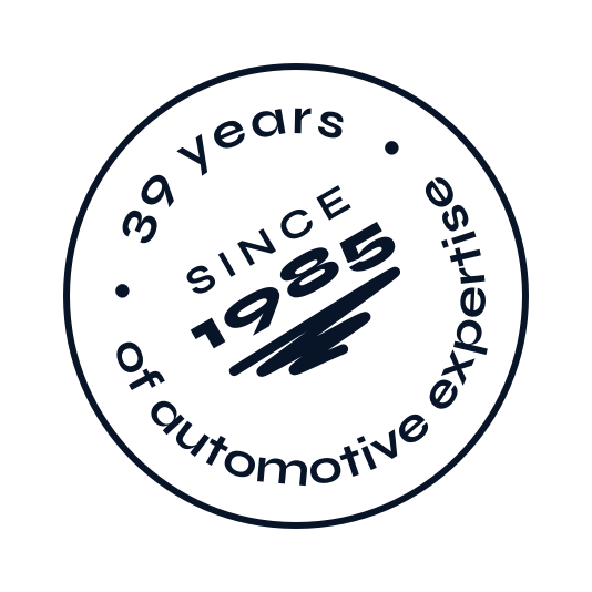 Badge "39 years of automotive expertise" in black